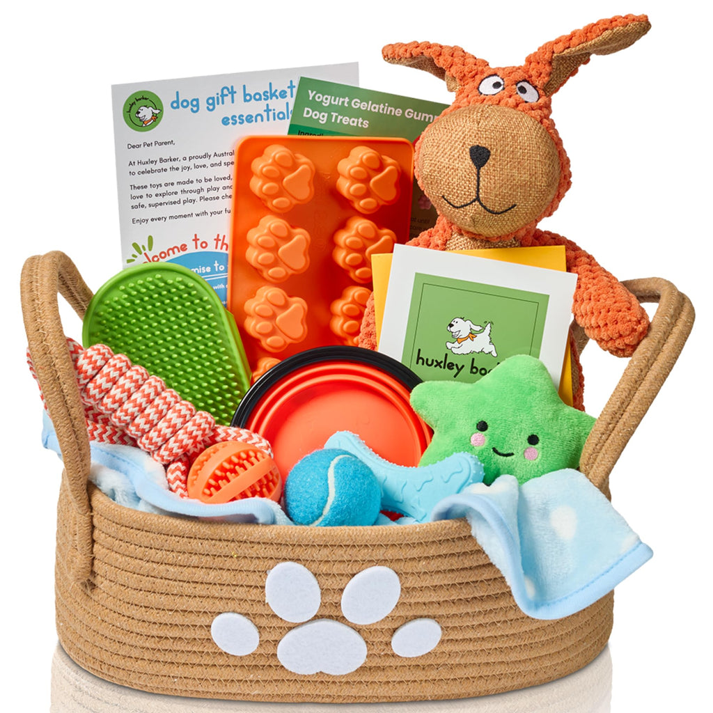 Huxley Barker New Puppy Gift Basket for Puppies, Adopted Dogs & Small Family Dogs - Chew Toys, Squeaky Toys, Toy Box, Treat Mold, Pet Blanket - Dog Gift Basket Essentials